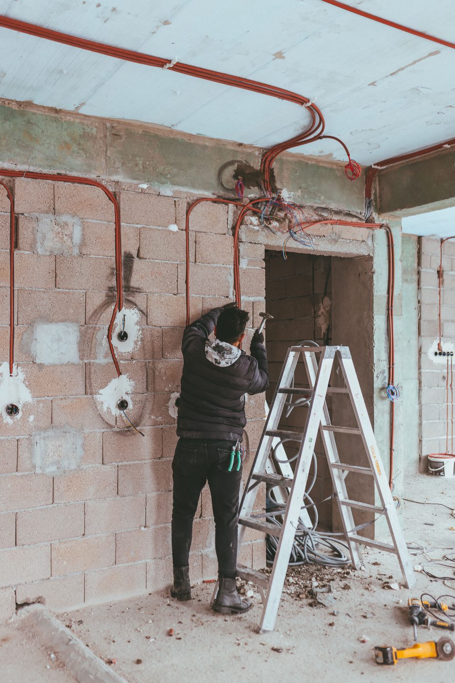 Plumber running supply lines during an installation