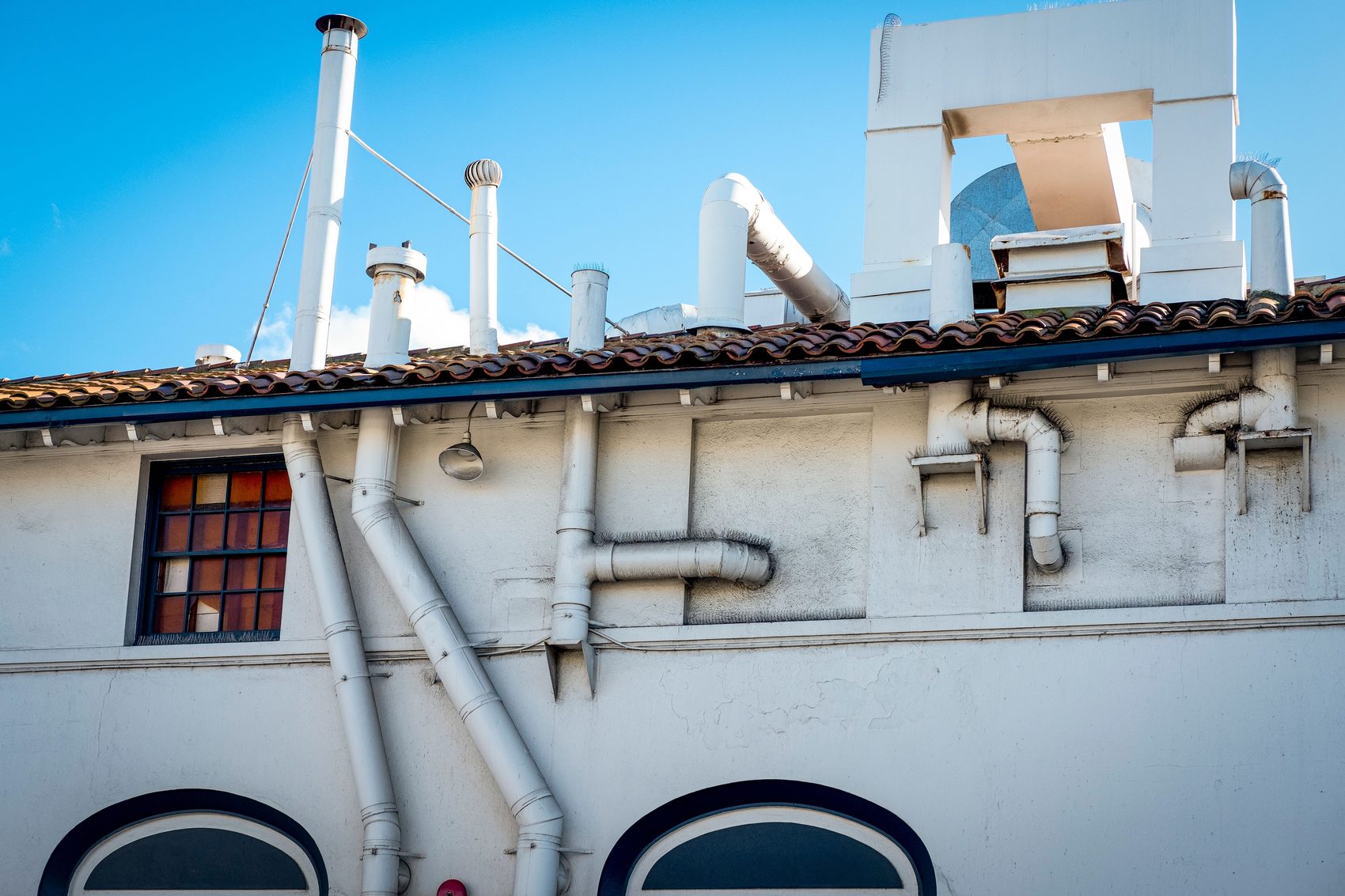 HVAC vent stacks and ductwork on a building rooftop